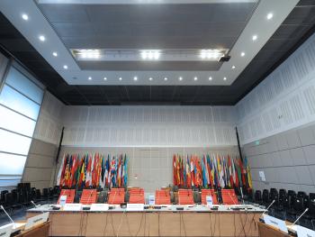 The OSCE participating States flags in a meeting hall at the Hofburg.